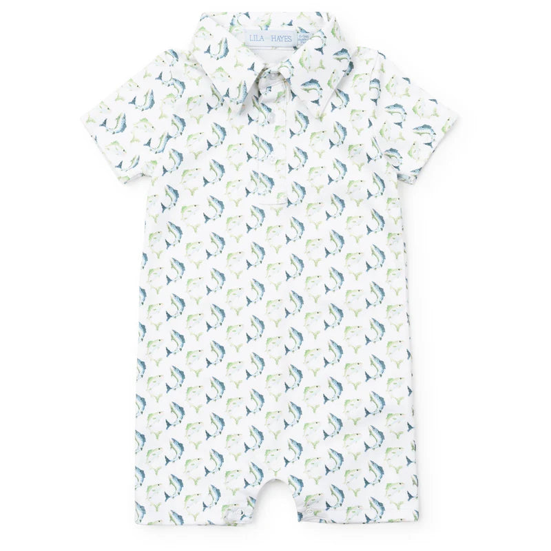 Short sleeve shortall with jumping trout design in blue and green on a cream background.