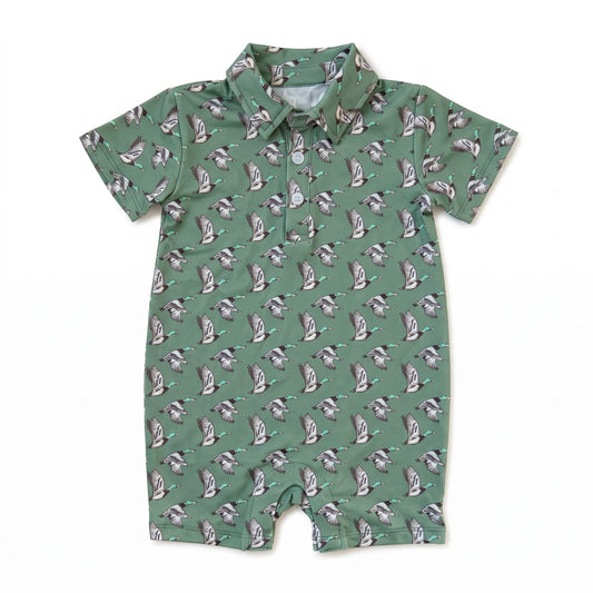 A short-sleeve baby romper in sage green with an all-over repeating print of ducks, shown flat on a white background.