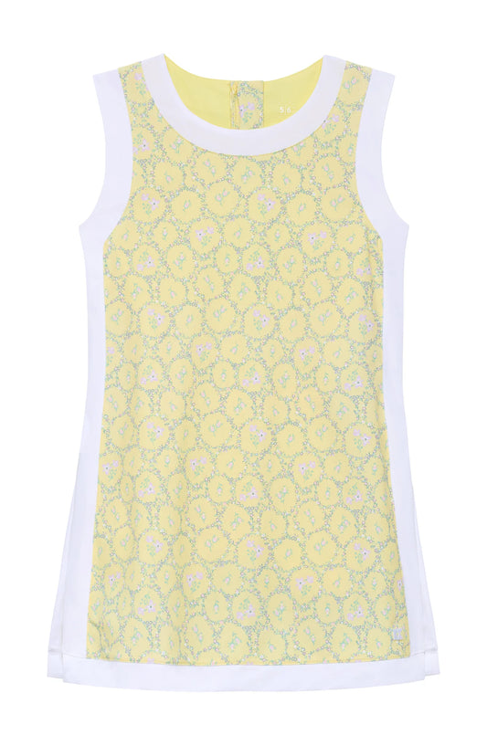 Yellow floral sleeveless dress with white trim with slits on side and biker shorts underneath