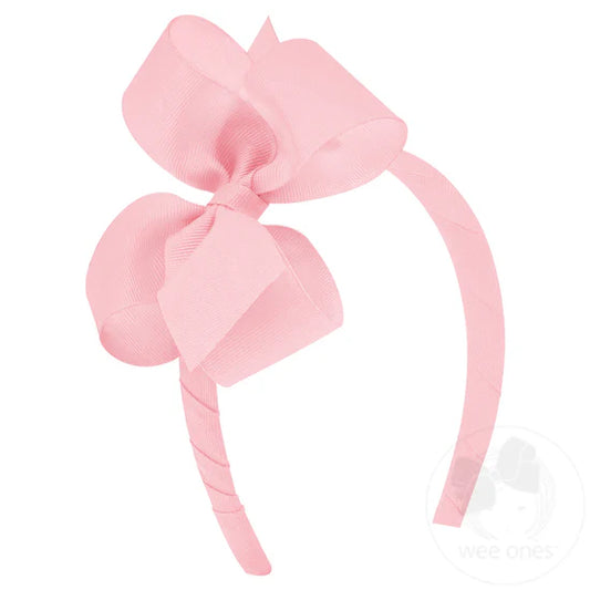 Pink bow on a pink headband