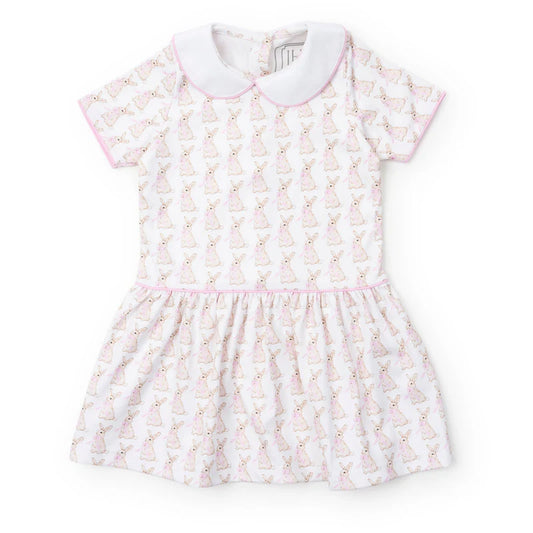 Short sleeve spring dress with bunnies with pink bows on a cream background, drop waist, pink trim and white collar.