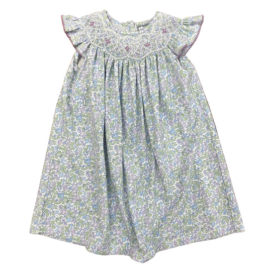 Lilac floral bishop dress with smocking and ruffle sleeves.