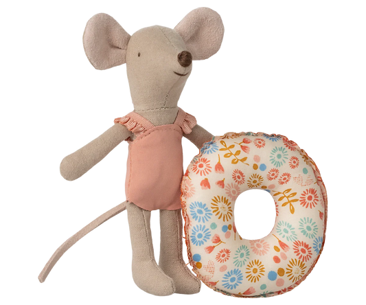 Stuffed mouse toy holding a floral cushion on a white background