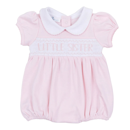Pink bubble with 'little sister' embroidered on smocking.