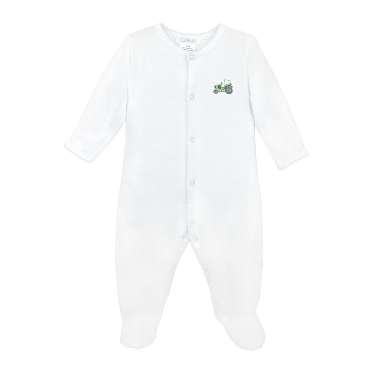 A white long-sleeve baby footed sleeper with snap closures down the front and a small green tractor graphic on the left chest, shown against a plain white background.