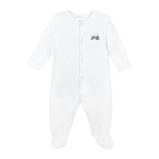 A white long-sleeve baby footed sleeper with snap closures down the front and a small green tractor graphic on the left chest, shown against a plain white background.
