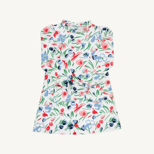 A sleeveless white dress with a colorful watercolor-style floral print featuring blue, red, and green flowers and leaves, displayed flat against a light off-white background.