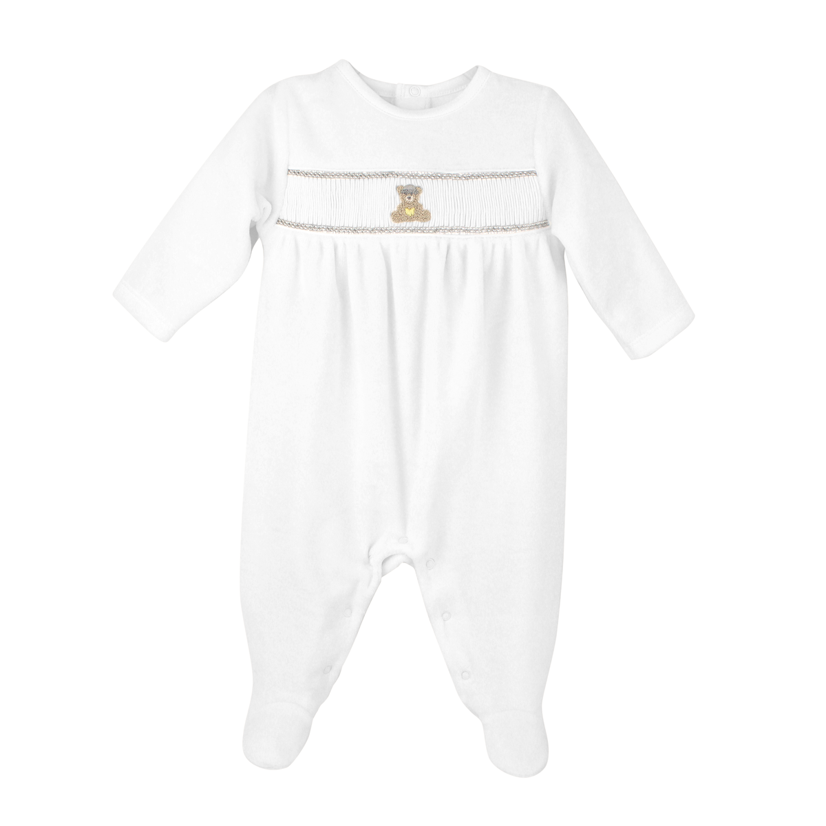 A white long-sleeve baby footed sleeper with smocked detailing across the chest, featuring a small embroidered teddy bear  and a decorative horizontal stripe.