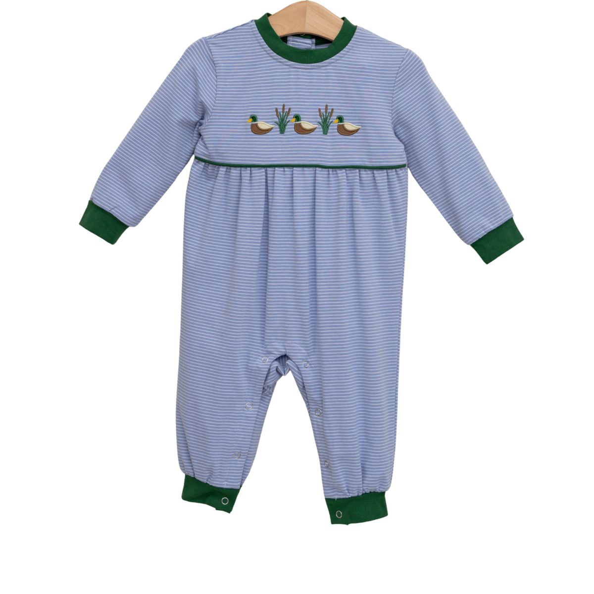 Blue striped romper with applique of three ducks and green tips on end of sleeves and pants  