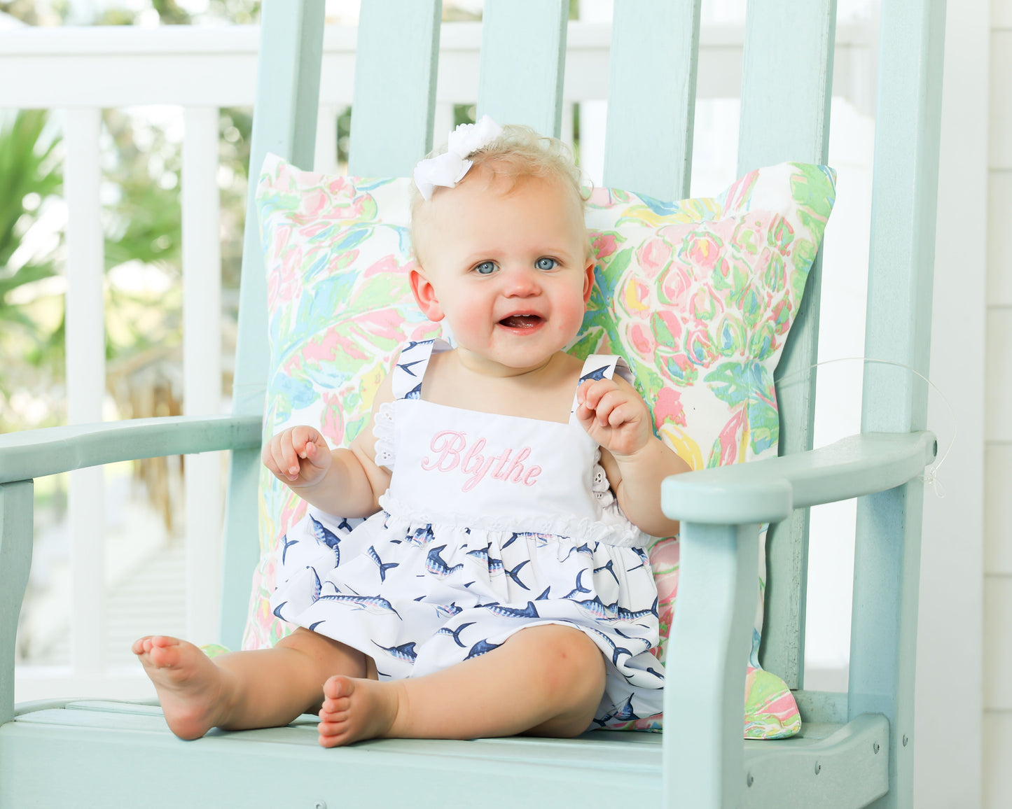white bubble with blue/pink marlin fish print with eyelet trim in middle 