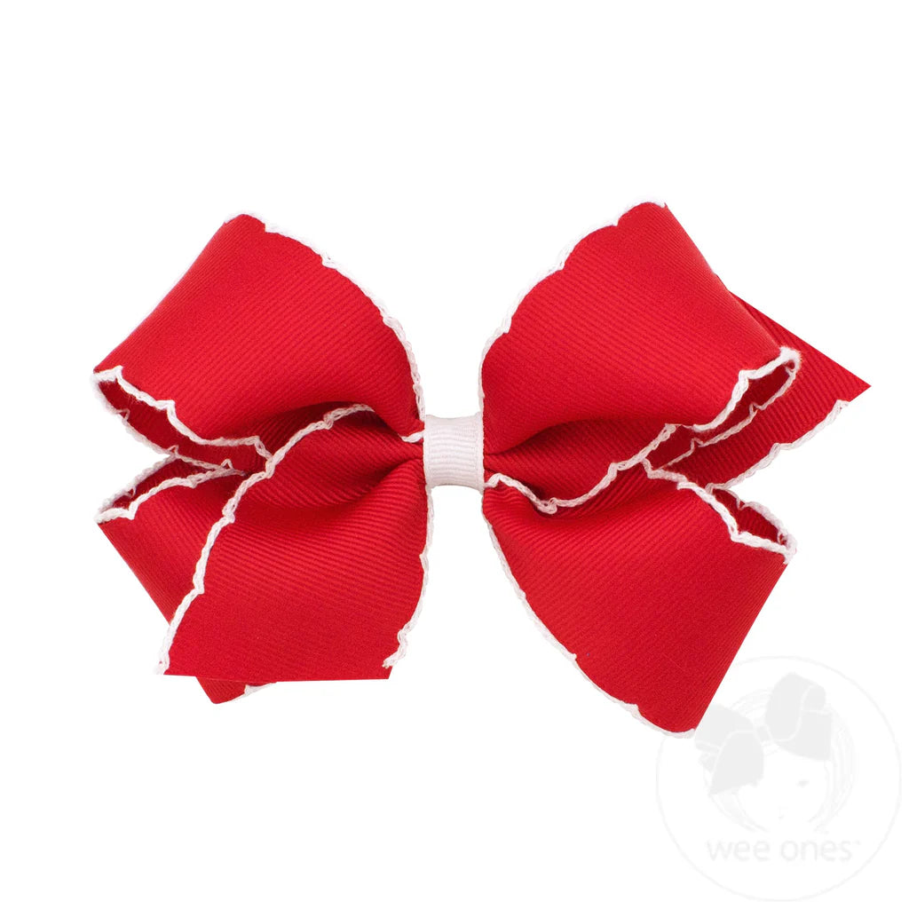 Medium Red bow with white moonstich desgin on edge 