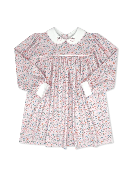 A long-sleeve baby dress with a delicate pink, blue, and white floral print, featuring a white Peter Pan collar with embroidered pumpkin collar