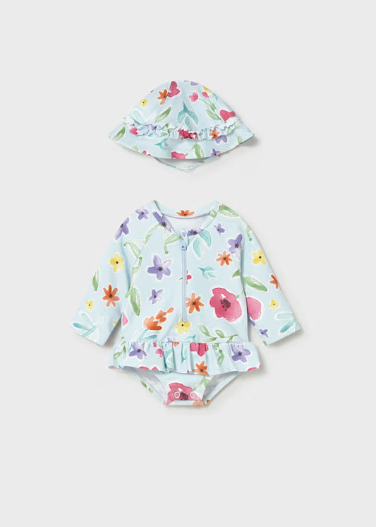 Bright floral one piece long sleeve bathing suit and matching hat.