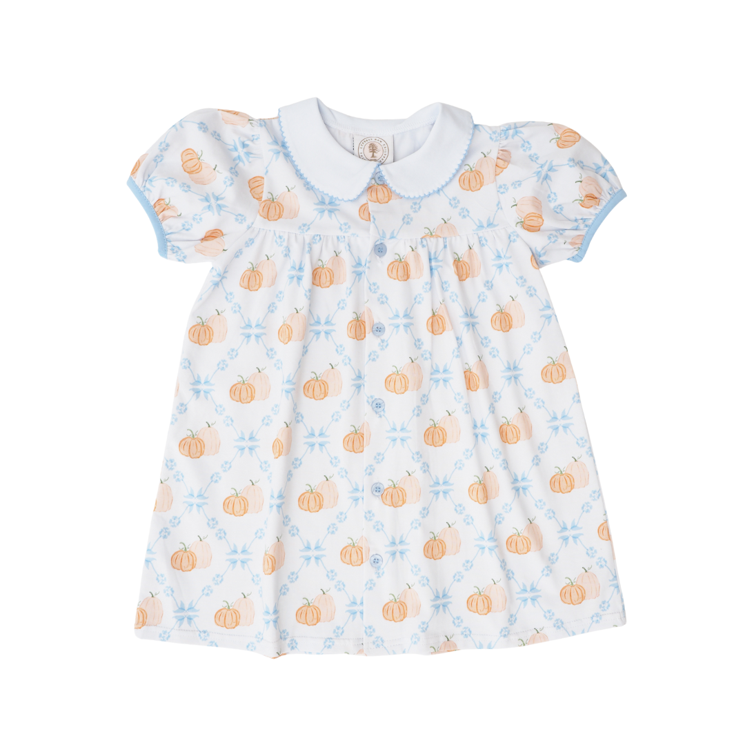 Baby dress with pumpkin and flower pattern on a white background