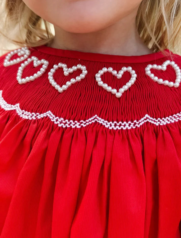 Red baby bloomer set with heart details on collar 