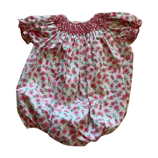 Pink floral bubble with smocked collar and short sleeves.