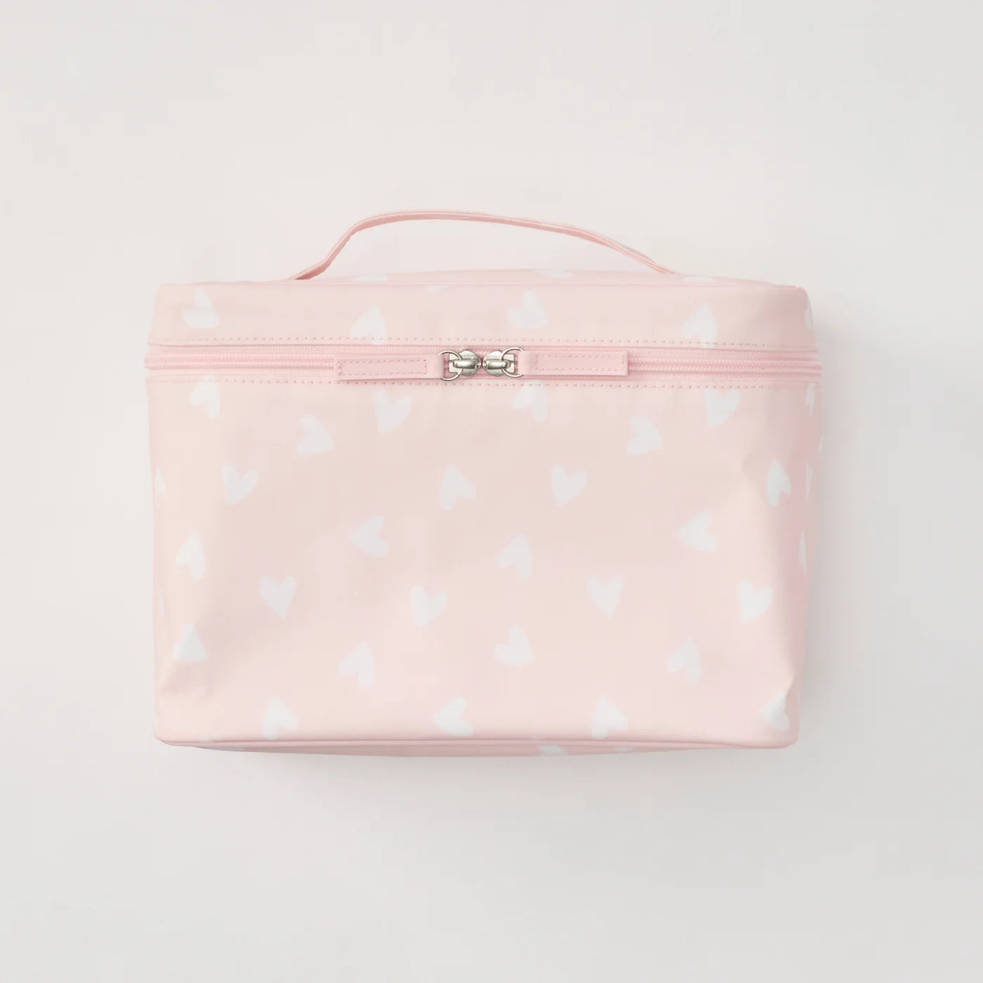A light pink zippered cosmetic bag with a top handle, decorated with a white heart pattern, shown against a plain white background.