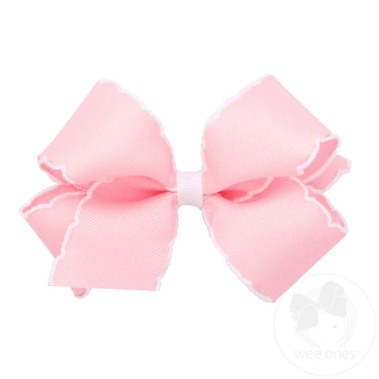 Medium light pink bow with white moonstitch trim