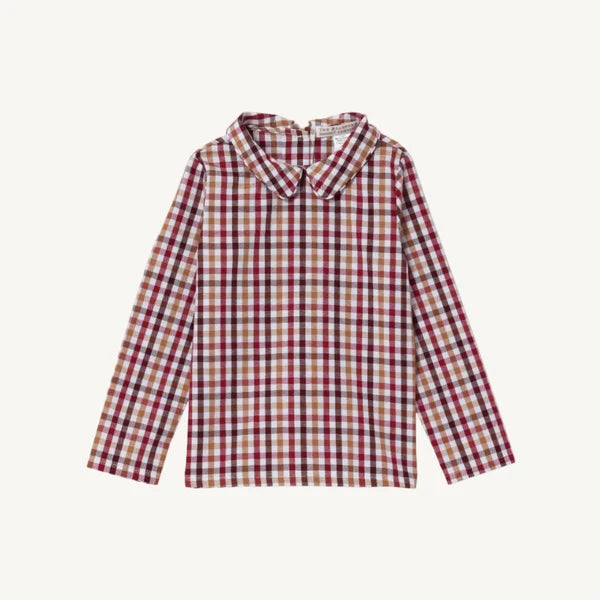 A long-sleeve collared shirt with a red, beige, and tan plaid pattern, displayed flat against a light cream background.