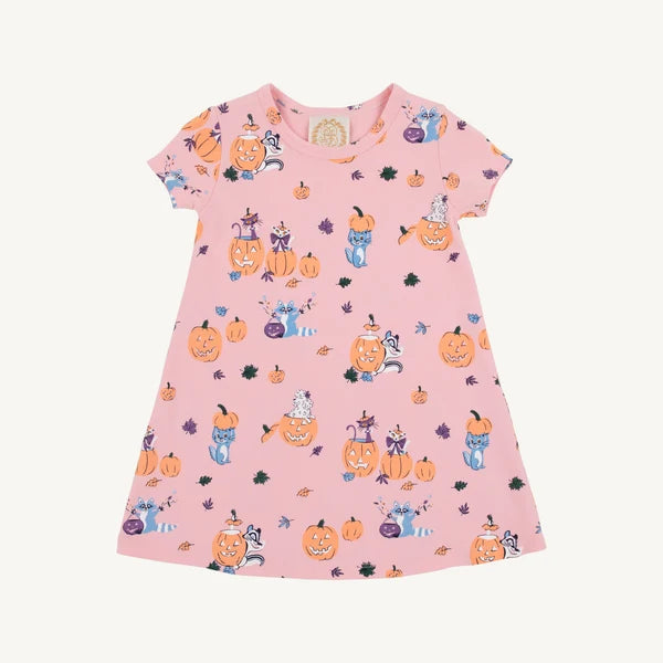 A pink short-sleeve baby dress with a cute Halloween print featuring pumpkins, ghosts, and cats, shown against a plain off-white background.