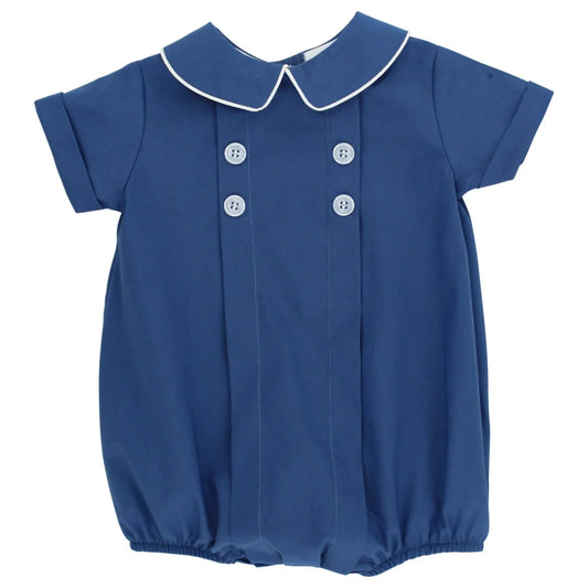 A short-sleeve baby bubble romper in cornflower blue with a white piped Peter Pan collar and white decorative buttons on the front, shown against a plain white background.