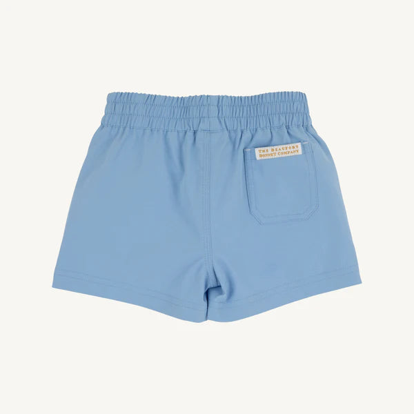 Light blue shorts with a brand label on a white background