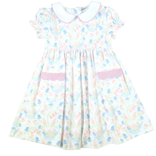 Pastel floral dress with white collar and pink trim.