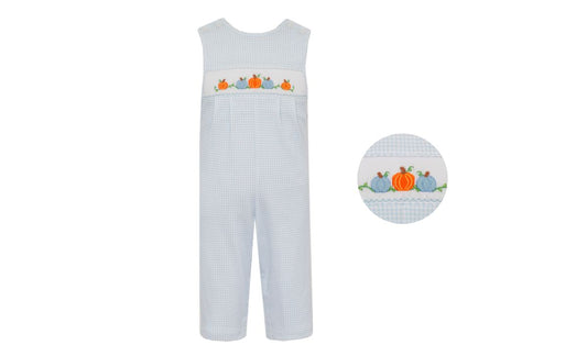 Children's overalls with pumpkin design on a light blue checkered background