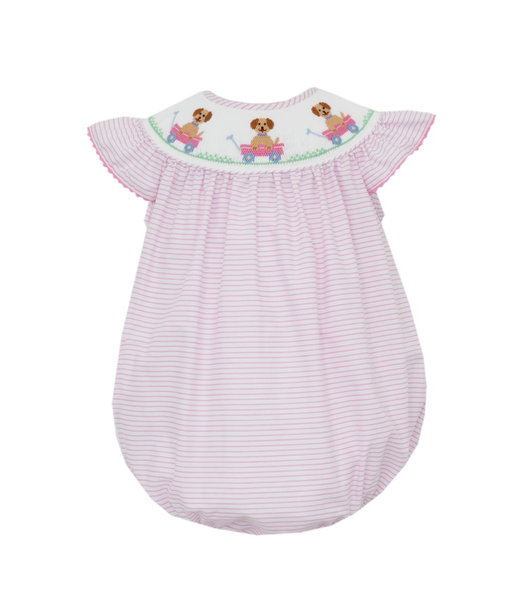 pink and white striped smocked bubble with dog in pink wagon 