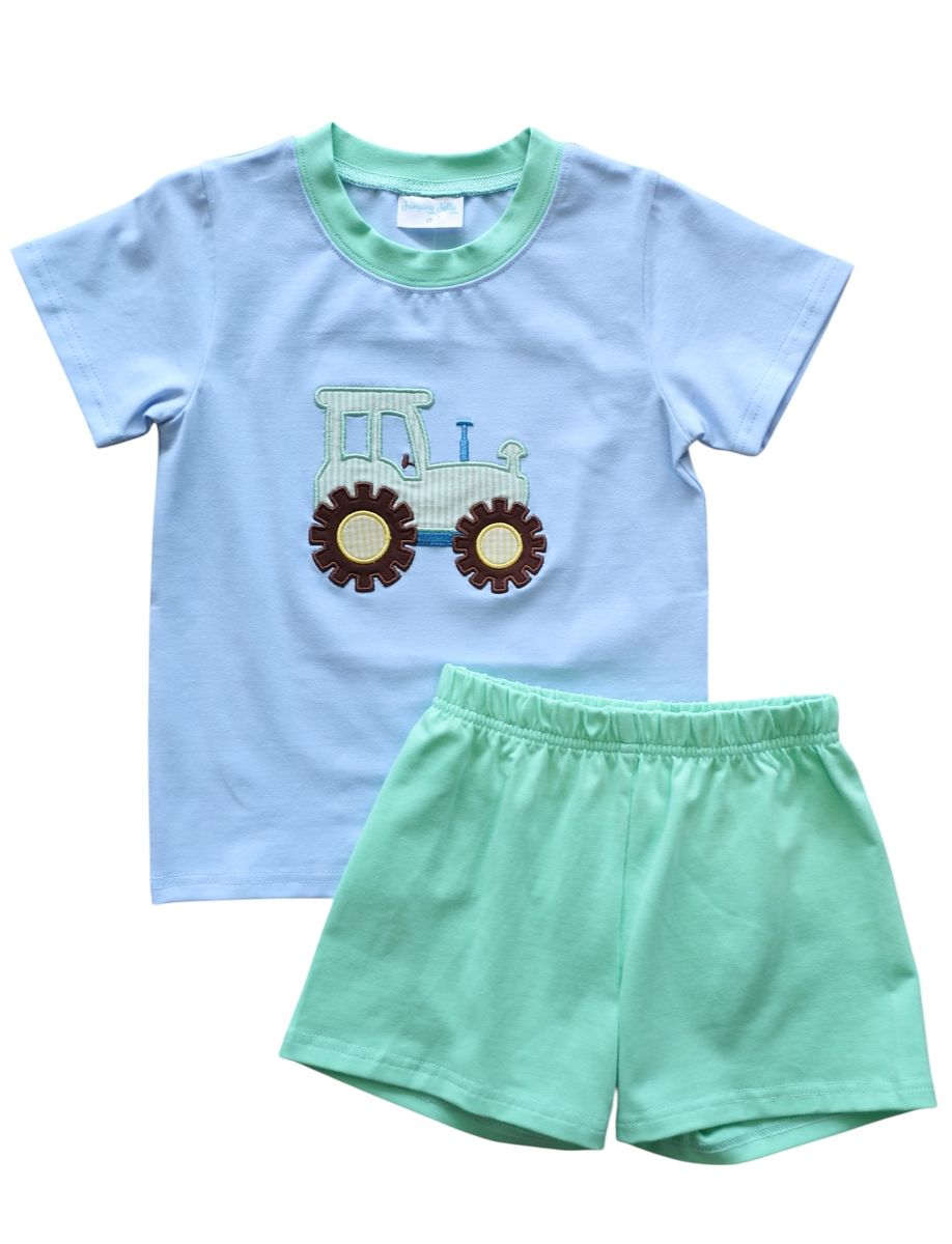 Light blue short sleeve tshirt with a tractor applique and green trim and matching green shorts.