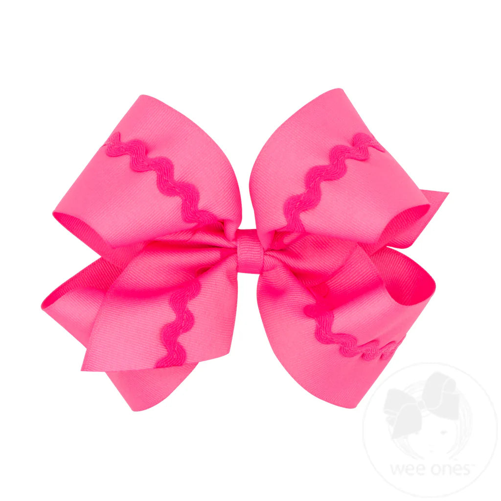 Large pink hair bow with ruffled pink edge 