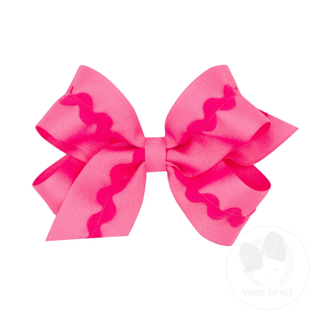 Pink hair bow with pink wavy rick design 
