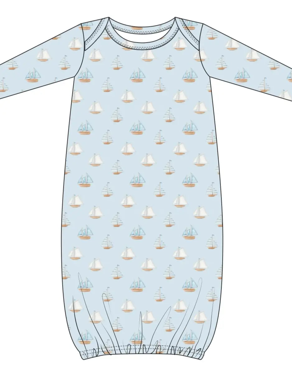 Baby bamboo gown with boat pattern on a light blue background