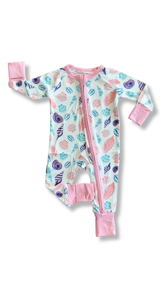 Baby onesie with colorful shell pattern on a white background