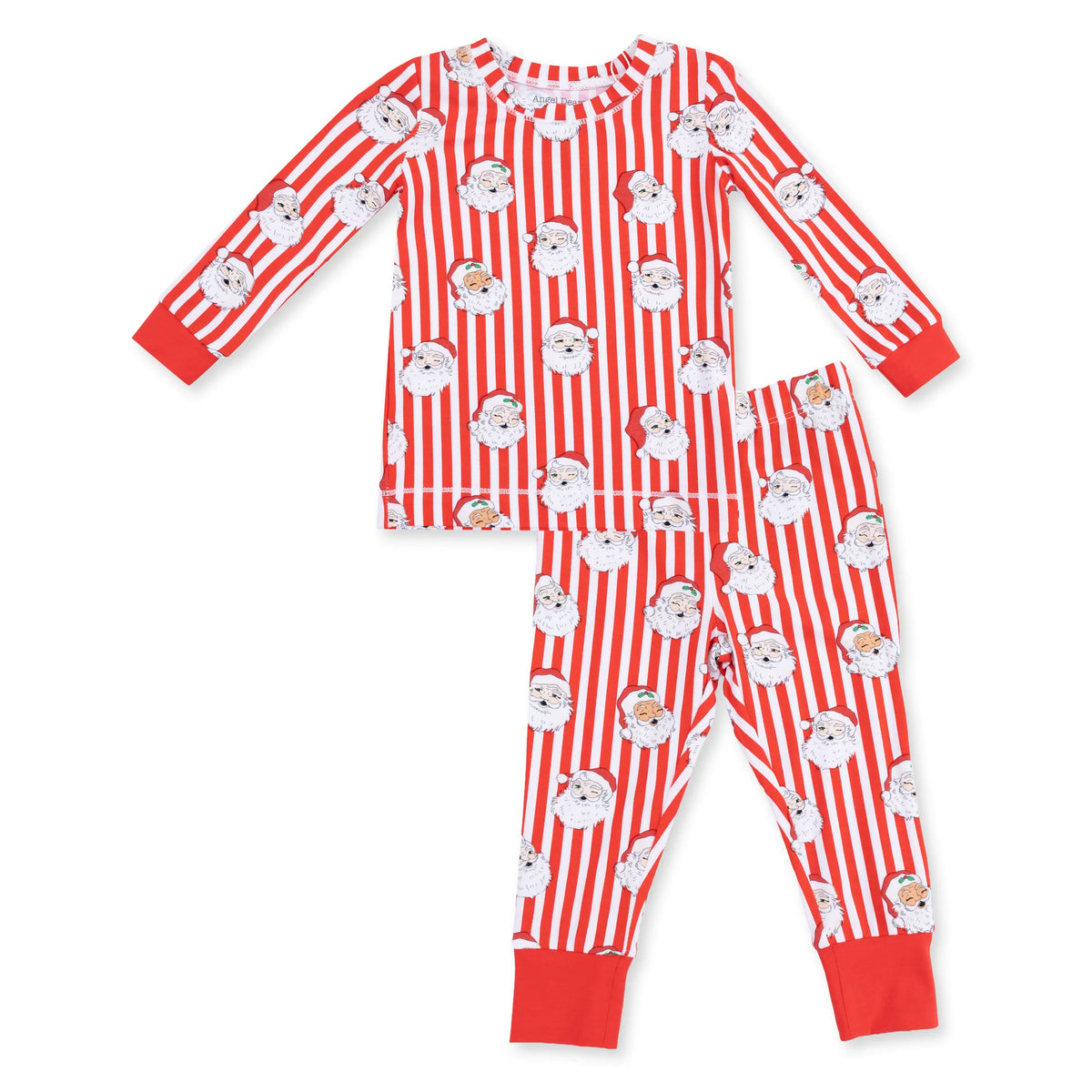 A two-piece children's pajama set featuring a long-sleeve top and matching pants with red and white vertical stripes and a repeating Santa Claus face print, finished with solid red cuffs and hem.