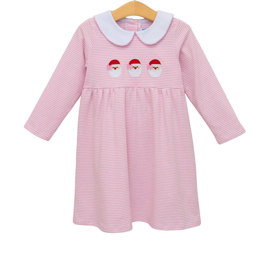 Pink striped dress with white collar and Santa face design on a hanger against a white background