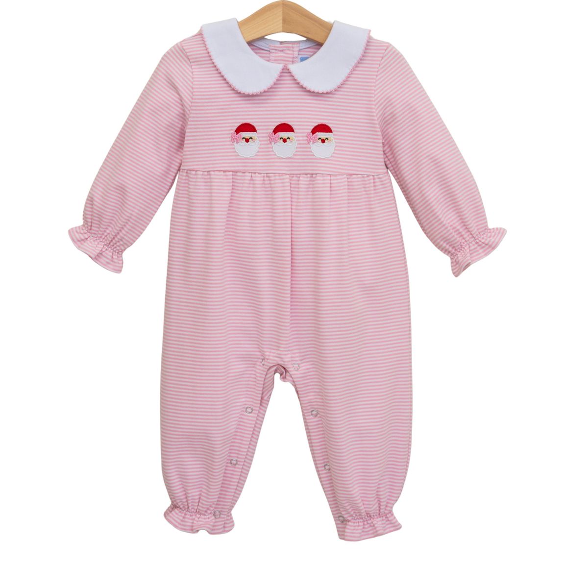 Pink baby romper with white collar and embroidered santa details on a white background