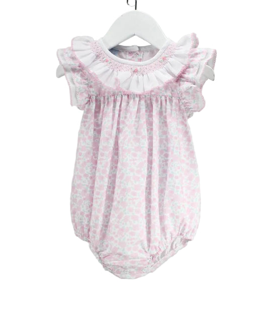 Pink floral baby smocked bubble with ruffle collar and sleeves.