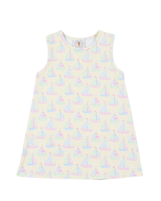 Girls sleeveless dress with sailboat pattern and a yellow background.