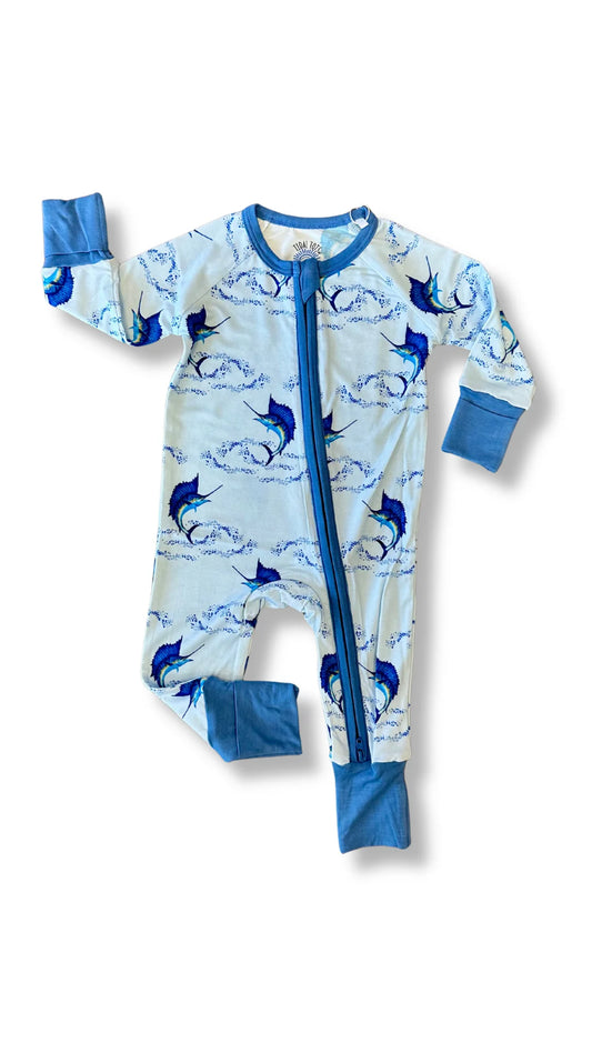 A baby long-sleeve footless sleeper with a blue and white marlin print, featuring a blue zipper and solid blue cuffs and collar, laid flat on a white background.