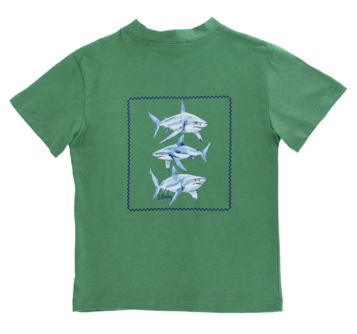 Green t-shirt with blue shark design,