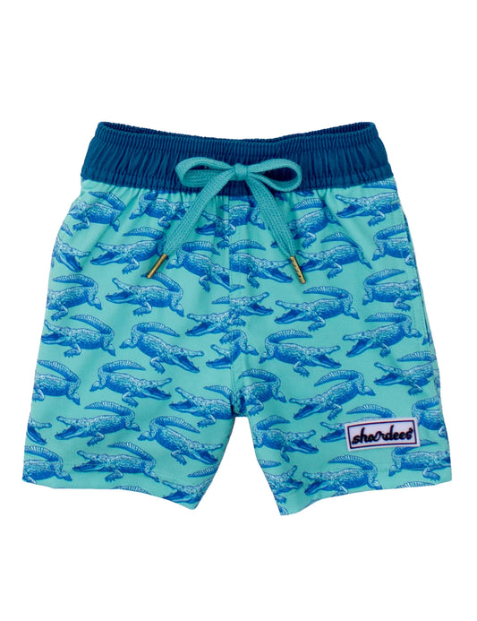 Green swim shorts with a blue elastic waistband and a blue alligator pattern.
