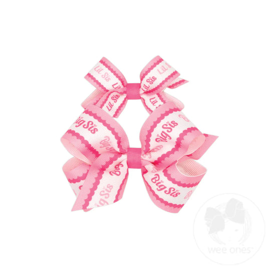 Pink hair bow set with 'Big Sis' text big bow and lil sis on smaller bow
