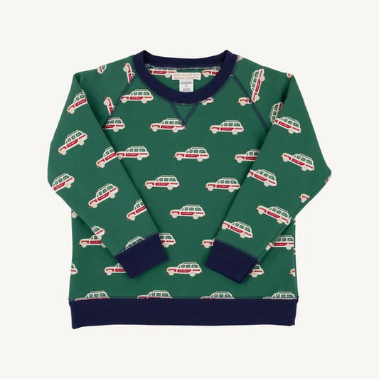 A green long-sleeve crewneck sweatshirt with an allover pattern of red and cream campervans, featuring solid navy blue ribbed collar, cuffs, and hem.