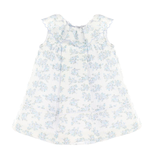 White dress with blue floral pattern on a white background