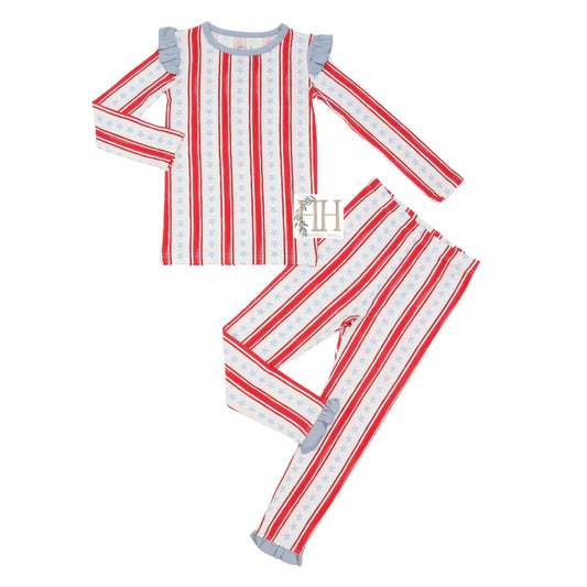 Two piece pajama set with ruffles and a red white and blue stars and stripes design.