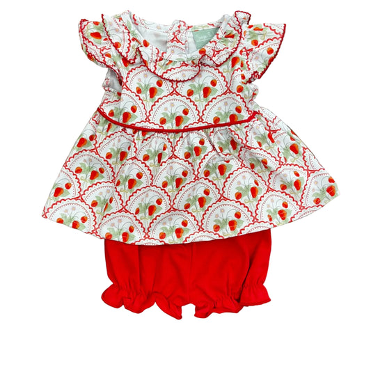 Ruffle sleeve and collar on a strawberry print top and red bloomers.