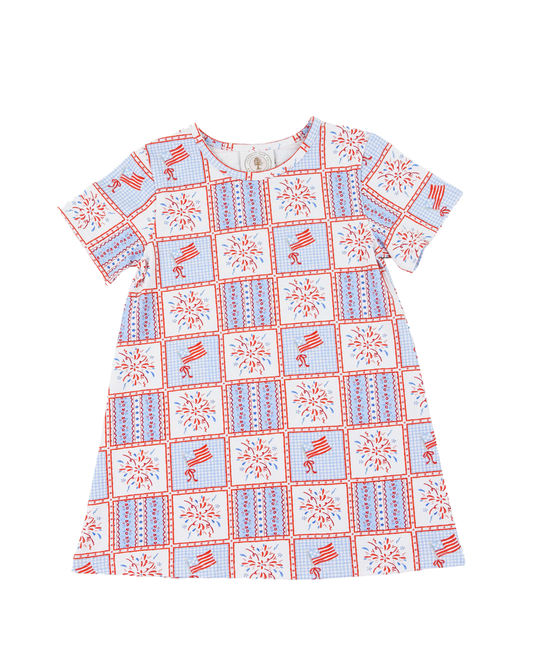Children's dress with red white and blue pattern with fireworks.
