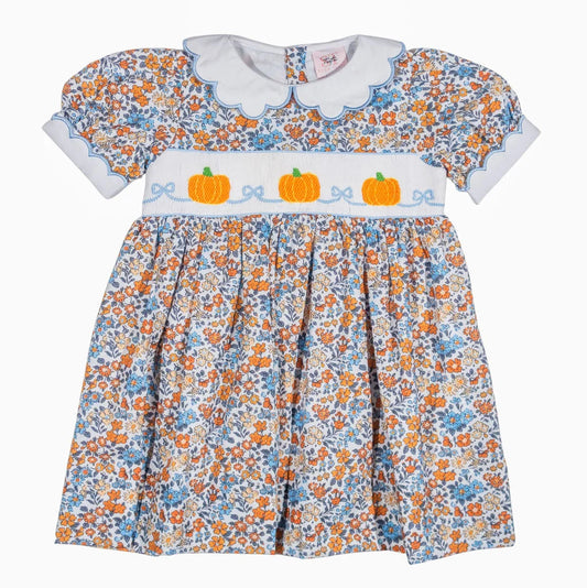 Children's dress with floral pattern and pumpkin design on a white background