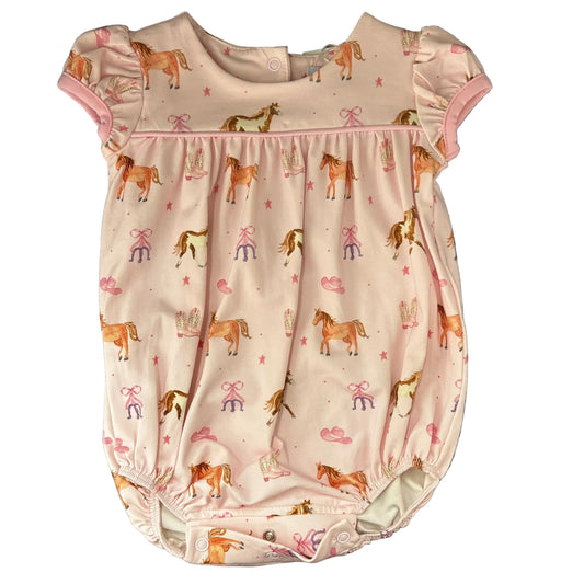 A short-sleeve bubble in light pink, featuring an all-over repeating pattern of  horses, horseshoes, cowboy boots and cowboy hats.